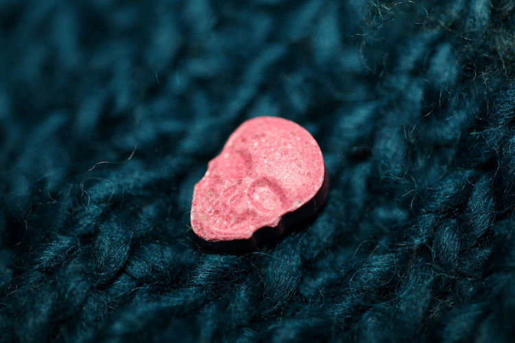 Purple skulls world's strongest ecstasy pills with mdma close up background high quality big size