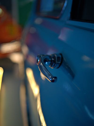 Close-up of vintage car handle at night