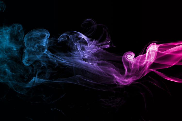Close-up of smoke against black background 