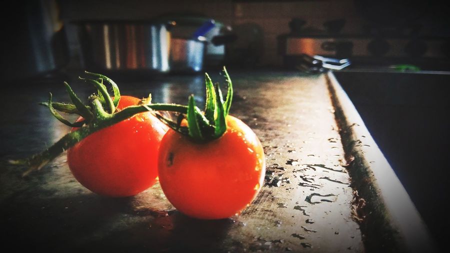 Close-up of tomatoes on table at home