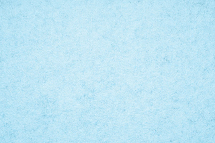 Full frame shot of snow on blue background