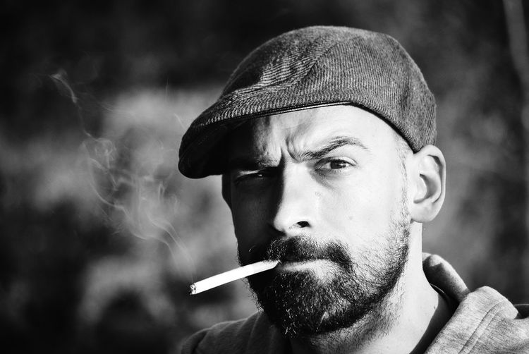 Portrait of man smoking cigarette