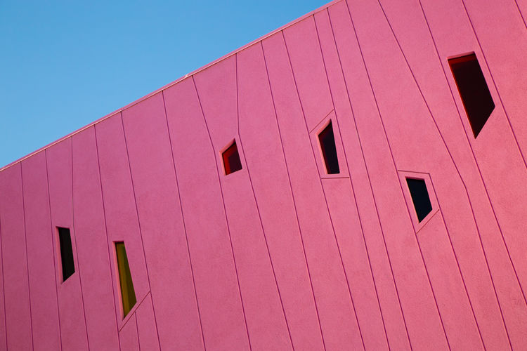 Low angle view of pink wall
