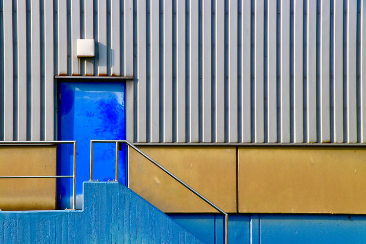 Blue stairway of industrial building in geometric shape