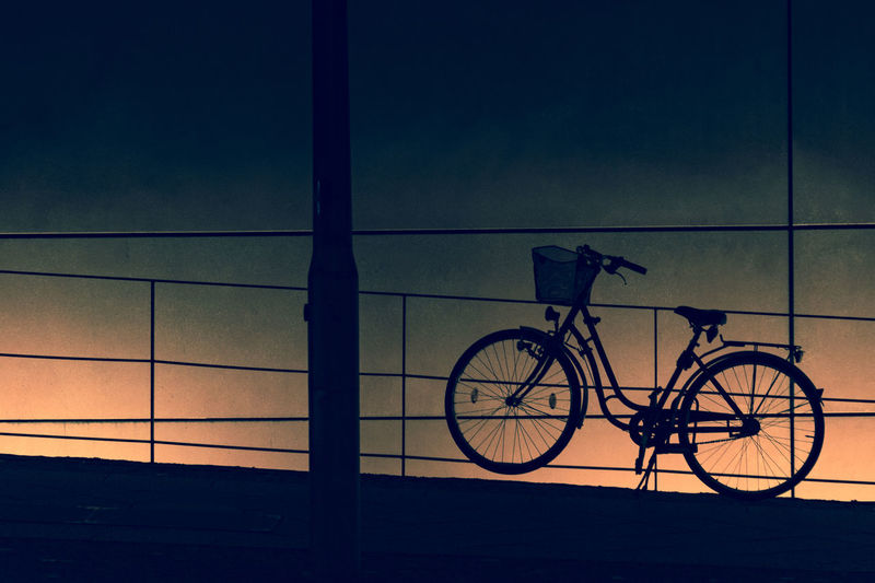 Bicycle against blue sky at night