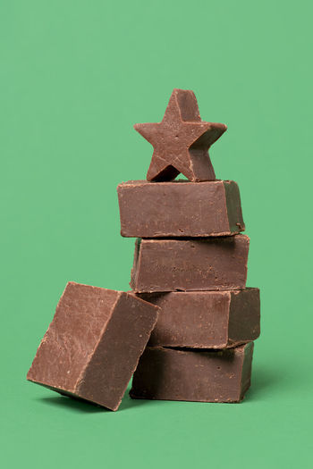 Close-up of stacked stack against blue background