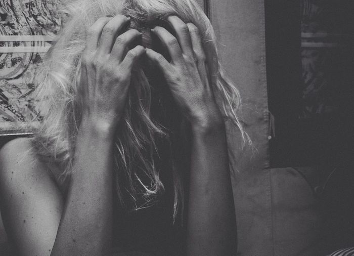 Woman covering face