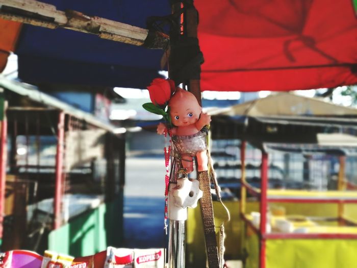 Close-up of stuffed toy hanging at market