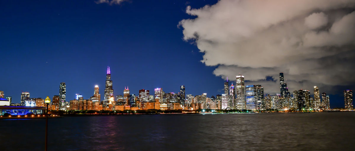Illuminated buildings in city at night
