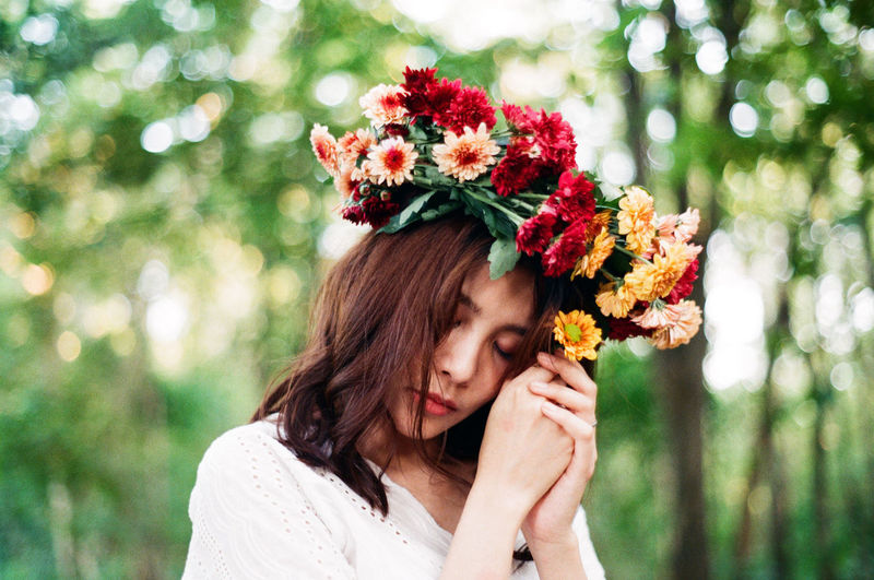 Close-up of woman wearing flower wreath