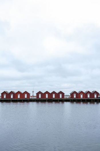 Red fishing huts on a gloomy day by the sea
