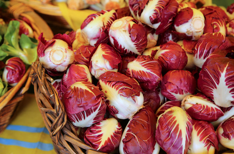Basket of red chicory for sale in a vegetable market