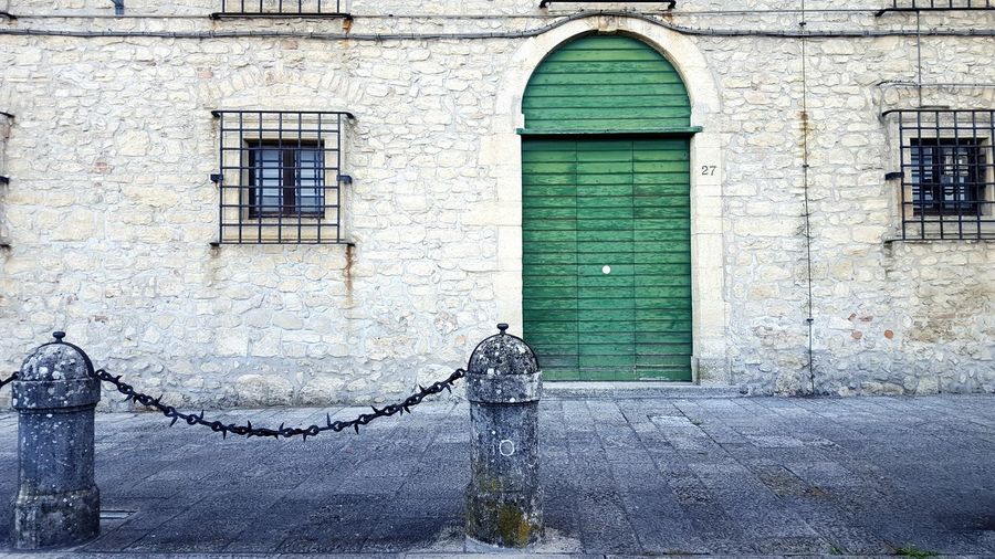 Closed green door of building