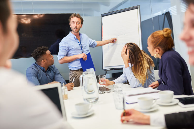 Businessman giving presentation at office
