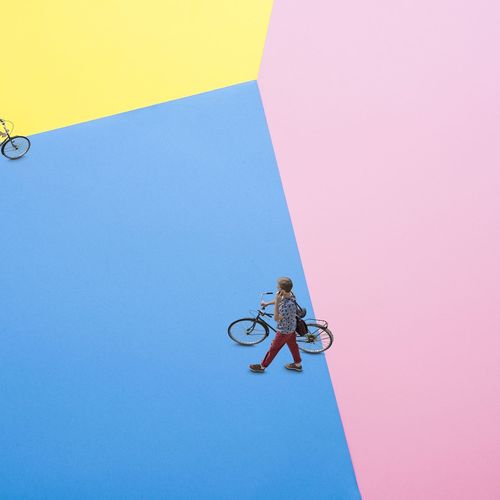 Low angle view of bicycle against clear blue sky