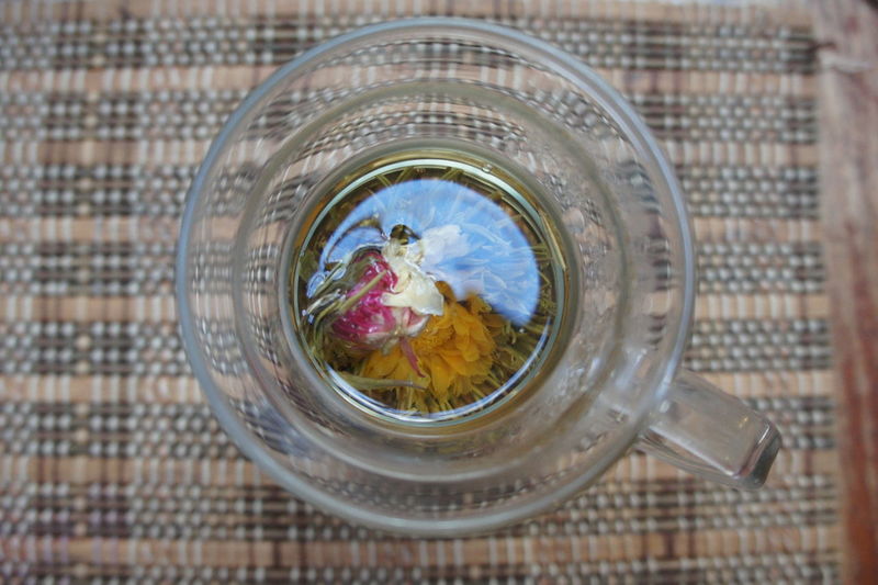 Directly above shot of flowers in glass mug