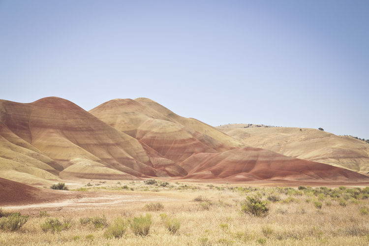 Scenic view of painted hills against clear sky