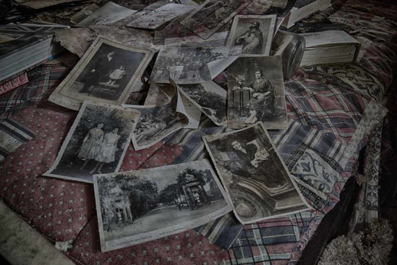 Old photographs lying on bed