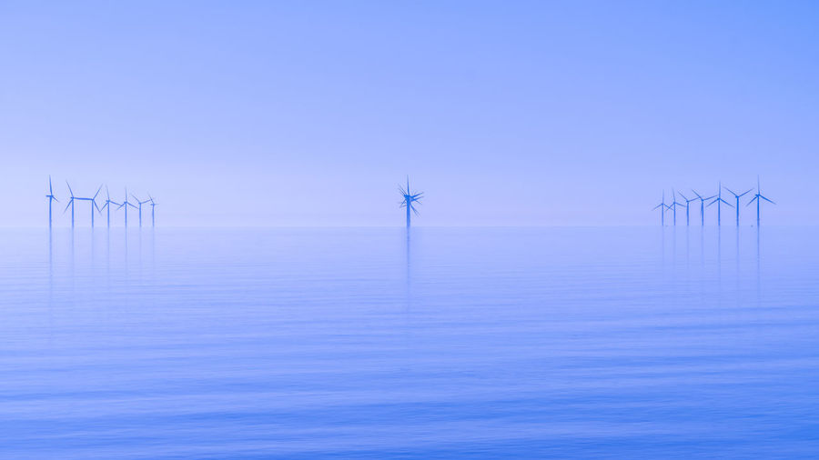 Offshore wind turbines generating renewable electricity and energy 