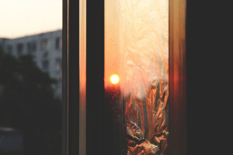 Close-up of window during sunset