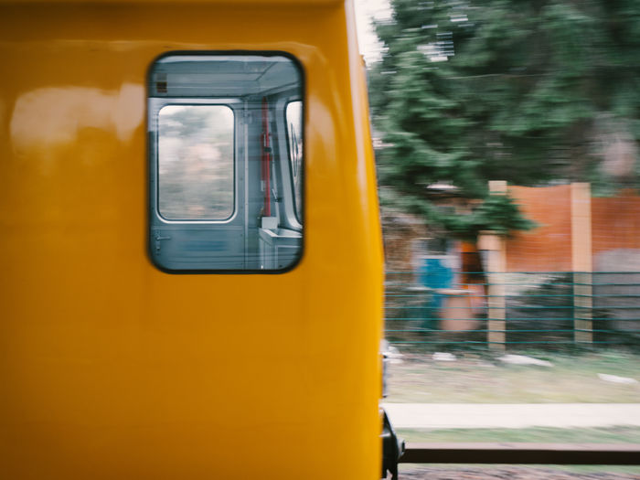 Close-up of yellow train window