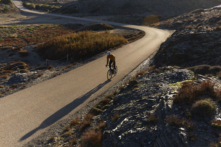 Young cyclist riding cycle on sunny day