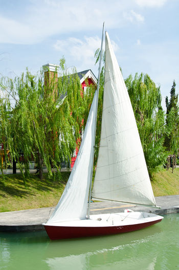 Sailboat in water against sky