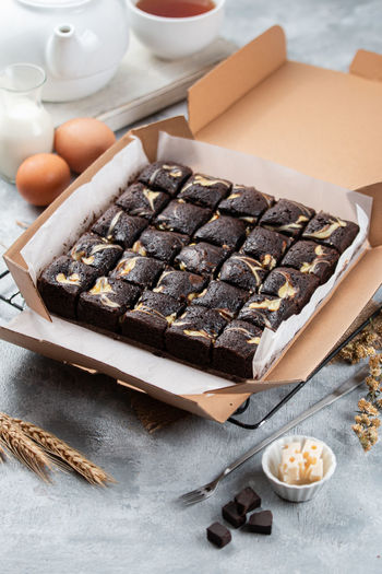 A high angle  view of photo of cream chesse brownies on table,