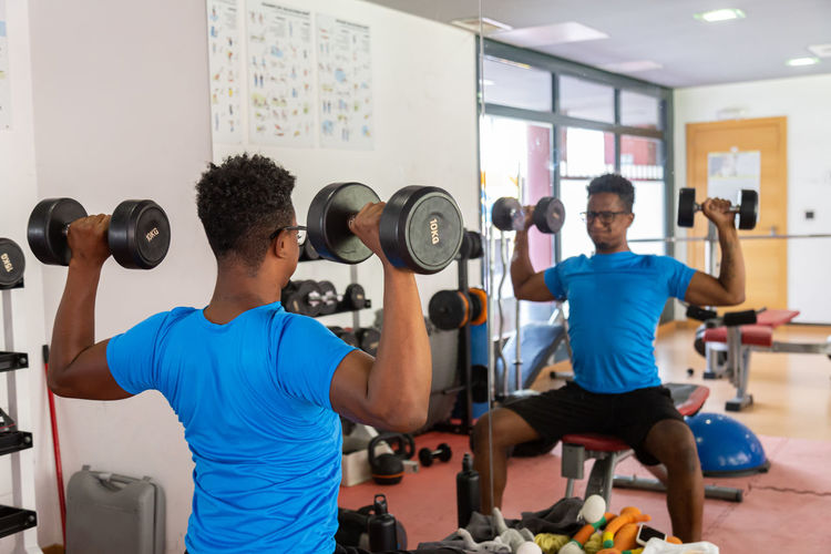 Midsection of woman exercising in gym