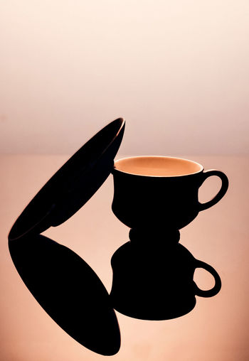 Close-up of silhouette coffee against black background
