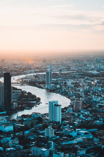 Sunset and twilight view of city. seen from mahanakhon tower famous skyscrapers