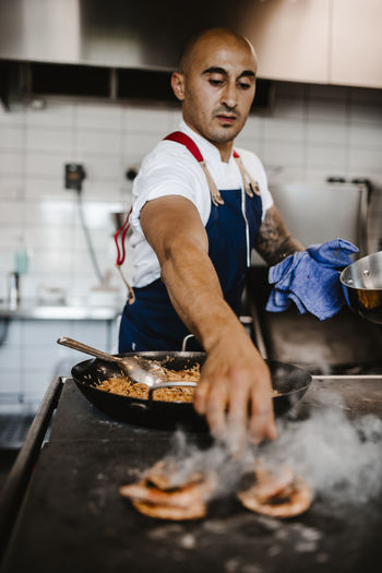 Chef preparing food in kitchen