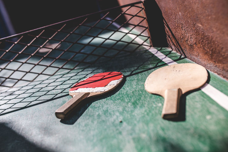 High angle view of tennis rackets on table