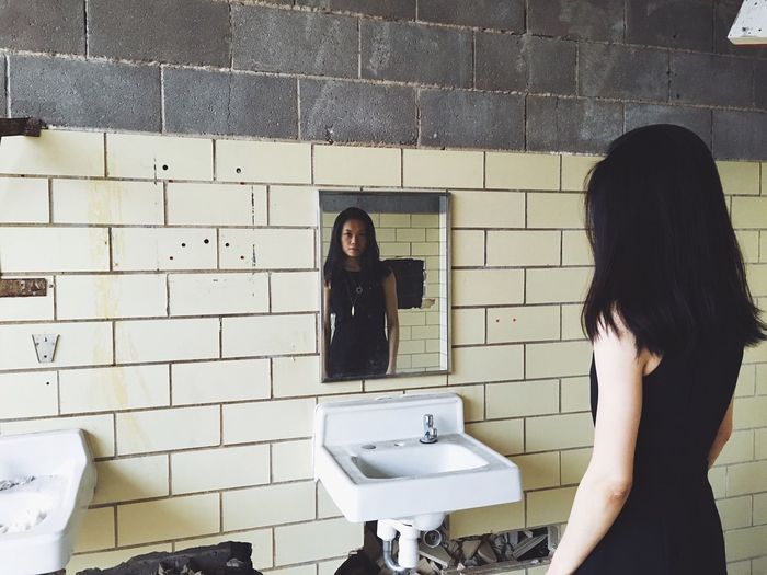 Young woman in bathroom