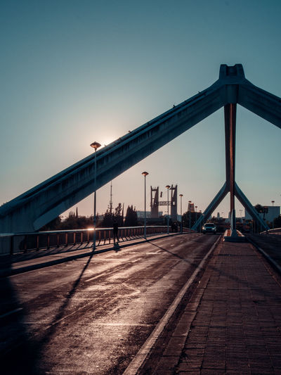 Crossing a bridge at sunset