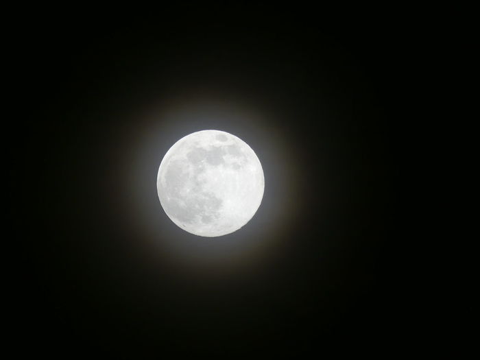 Low angle view of full moon in sky