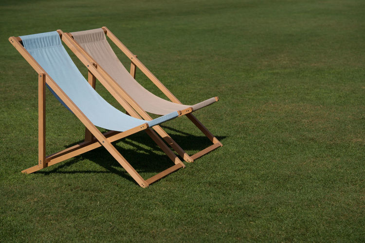 Two lounge chairs on the grass
