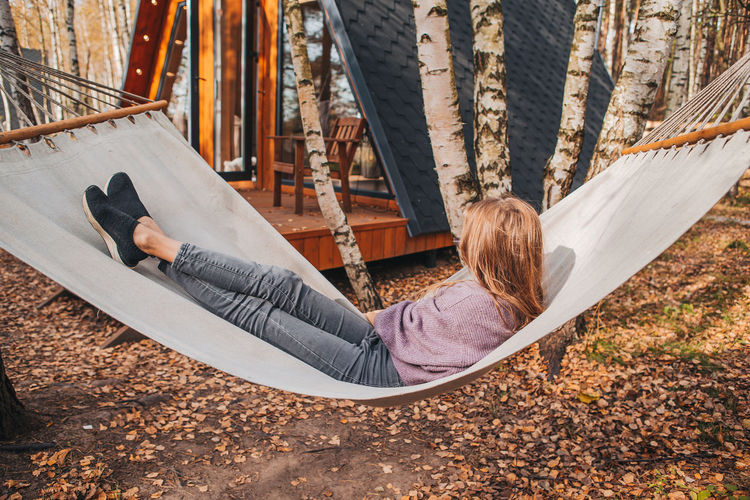 Woman lying down on hammock