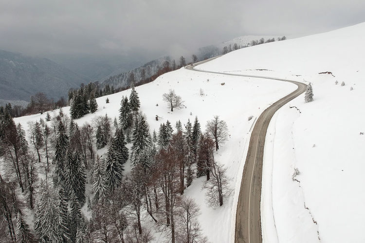Scenic view of snow covered mountain against sky