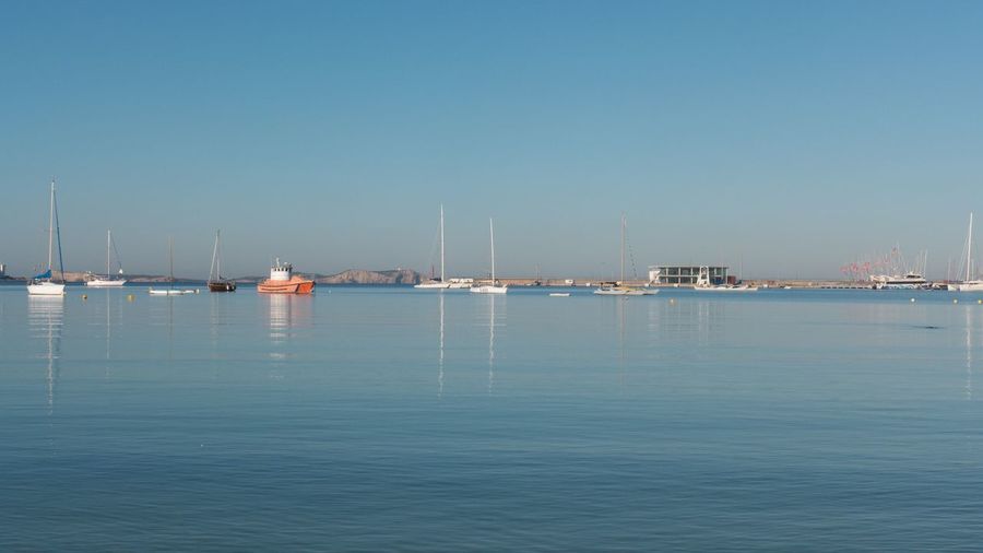 Scenic view of sea against clear blue sky