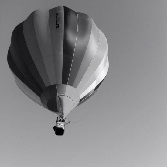 Low angle view of hot air balloon flying in sky