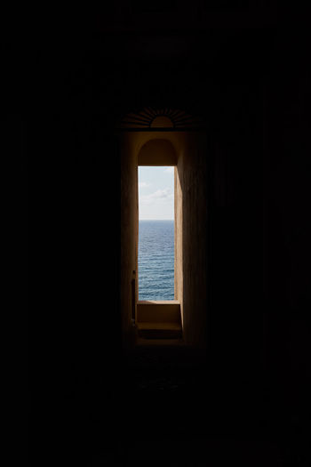 Sea seen through window of building