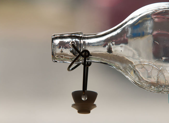 Cropped image of glass bottle with cork