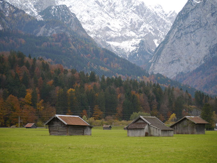 Scenic view of houses amongst mountains