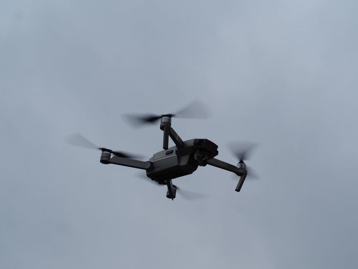Low angle view of drone against clear sky