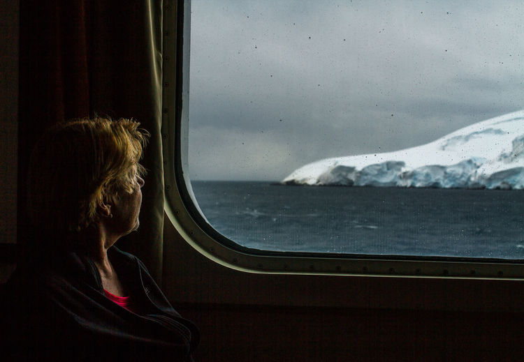 Antarctis Beauty In Nature Day Journey Looking At View Looking Through Window Mode Of Transport Nature One Person Passenger Real People Sea Seascape Sitting Travel Window Women First Eyeem Photo
