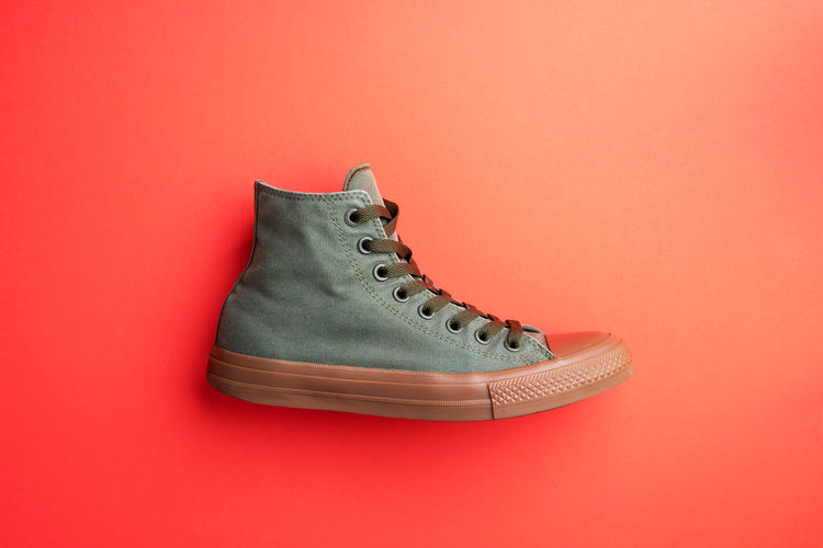 High angle view of shoes on red background