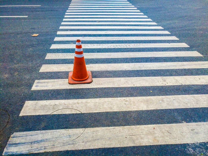 High angle view of traffic cone on crosswalk