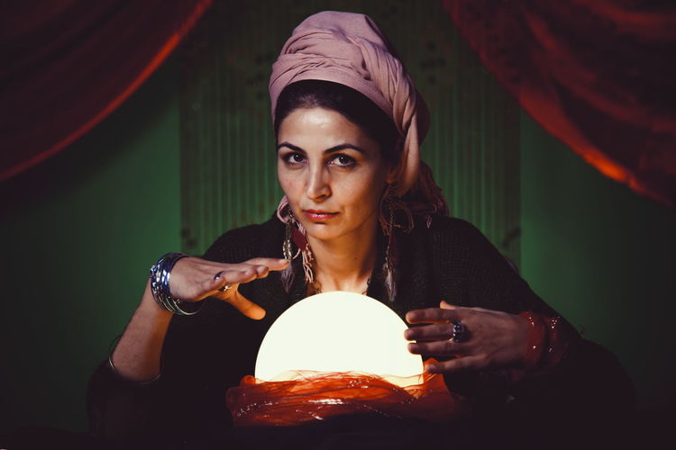 Female fortune teller with crystal ball