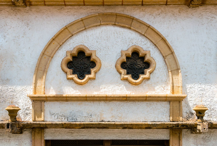 Close-up of carvings on wall of building